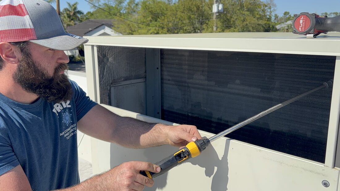 Fritz technician repairing an AC unit